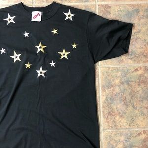 large black t-shirt with gold & silver star patch